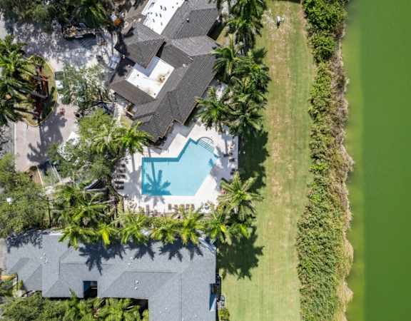 arial view of a house with a swimming pool