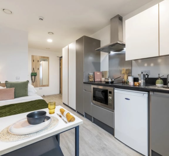 a kitchen and living room in a 555 waverly unit
