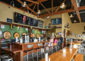 Thumbnail 1 of 10 - People Sitting at Bar at Restaurant in Portland, Oregon