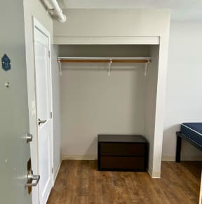 a walk in closet in a 555 waverly unit