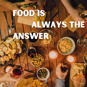A group of people enjoying a meal together with the text "FOOD IS ALWAYS THE ANSWER" overlaid on the image.