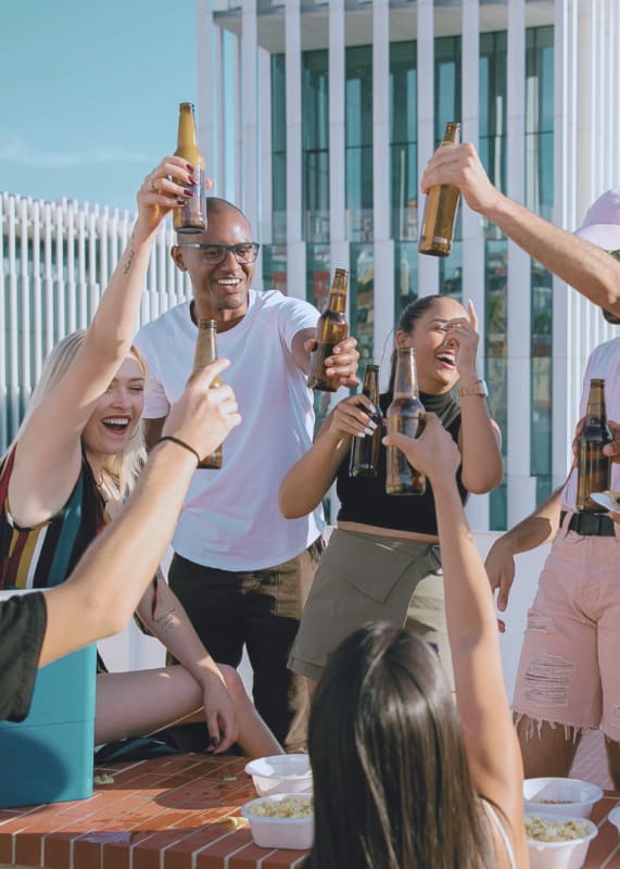 a group of people on a terrace cheering at Crogman School Lofts in Atlanta, GA