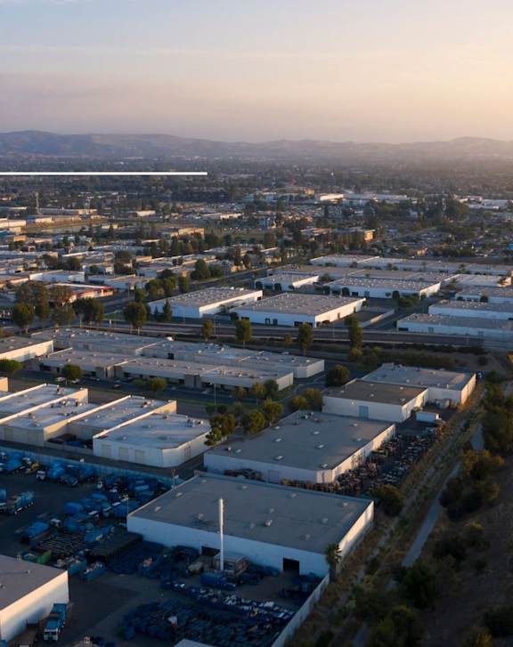 an aerial view of industrial buildings in the city
