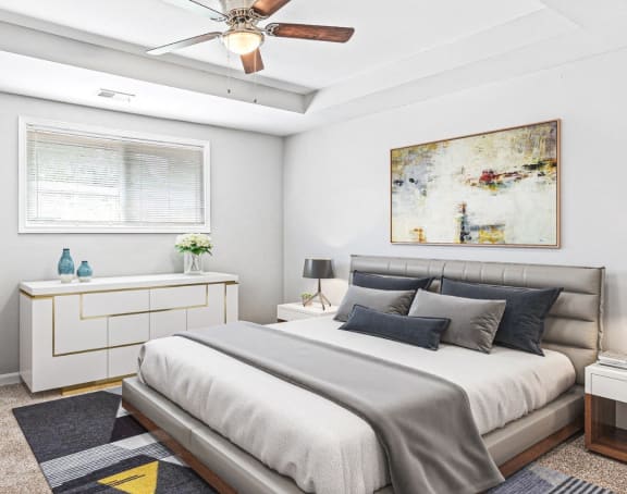 a bedroom with a bed and a ceiling fan at Uphill Flats, Decatur, 30032