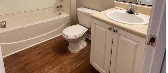 a bathroom with a toilet sink and bathtub