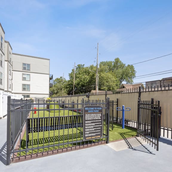 the gate to the playground of a school in front of an apartment building  at 45 Madison Apartments, Kansas City, MO
