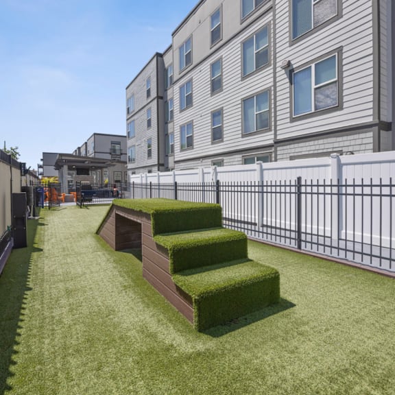 a grass covered seating area in front of a building  at 45 Madison Apartments, Kansas City, Missouri