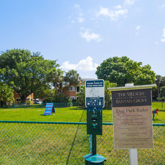a sign for the walkers batman corner and dog park rules at The Villages of Banyan Grove, Boynton Beach, FL, 33436