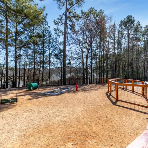 a red fire hydrant in the middle of a playground
