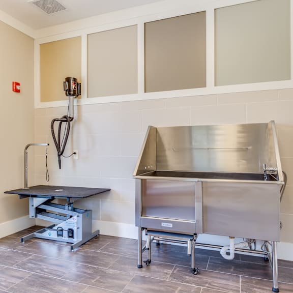 a commercial kitchen with stainless steel appliances and a sink