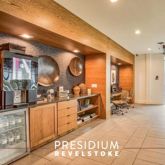 the lobby of a coffee shop with a coffee machine on the counter at Presidium Revelstoke, Texas