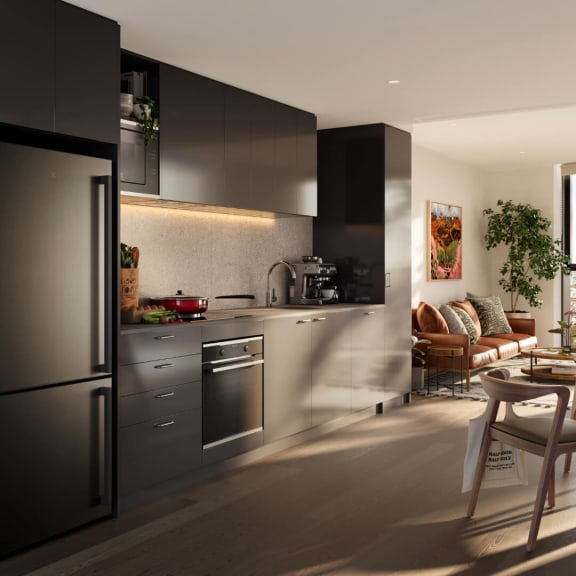 a kitchen with a stainless steel refrigerator and a table