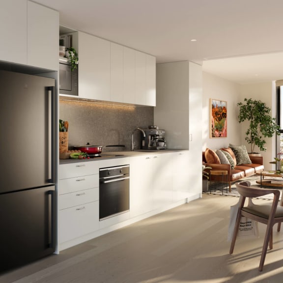 a white kitchen with a stove and a refrigerator