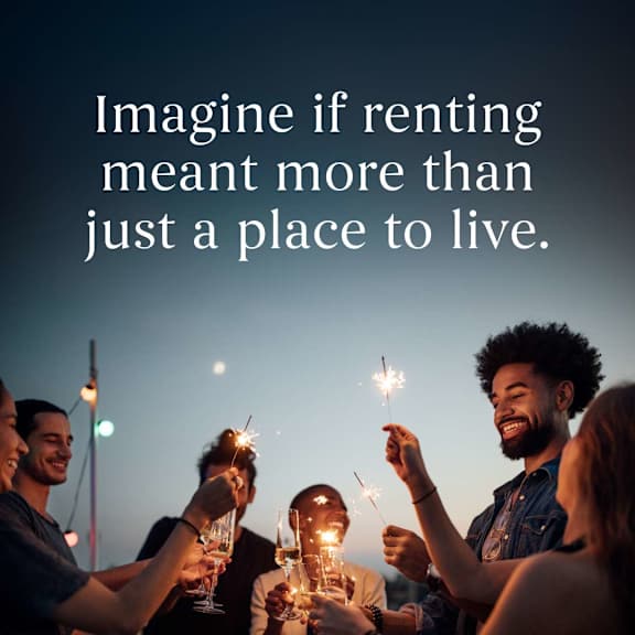 A group of people holding sparklers with the text "Imagine if renting meant more than just a place to live."