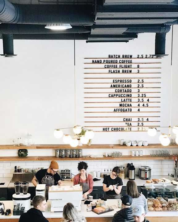 A coffee shop with a menu board showing various coffee options. at The Fowler Apartments, Boise, ID