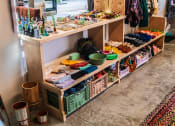 Thumbnail 11 of 14 - Clothes and Home Goods Items on Display