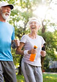 An older couple jogging in a park at Clarkston Station Apartments, Clarkston, Georgia