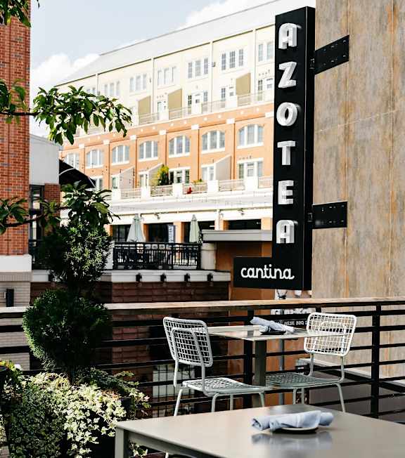 A restaurant named Azote is located on the ground floor of a multi-story building at 445 Cleveland Apartments in GA, 30354