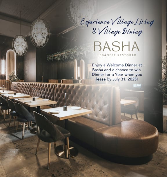 A restaurant interior with a sign that reads "Basha Lebanese Restobar".