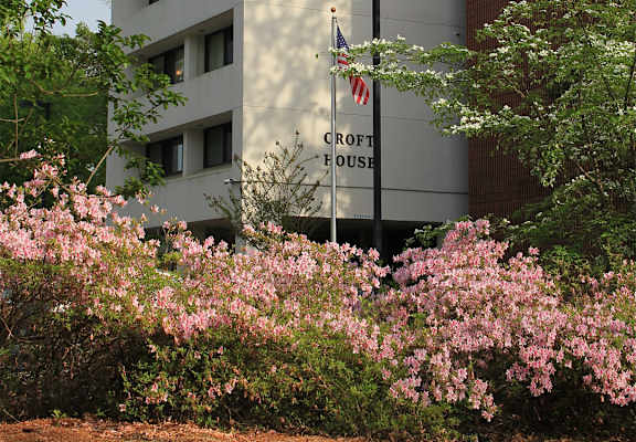 A white building with a sign that says Croft House.