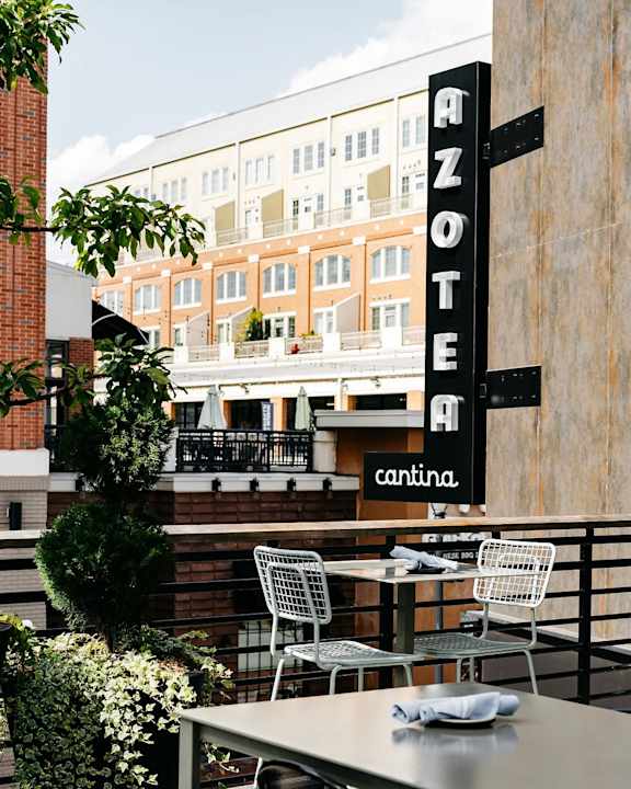 A restaurant named Azote is located on the ground floor of a multi-story building.