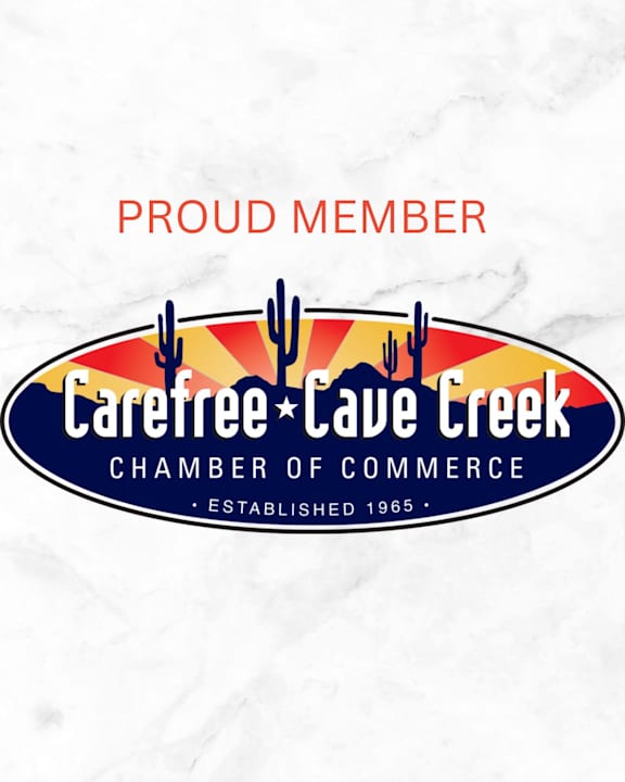The image is of a logo for the Carefree Cave Creek Chamber of Commerce, established in 1965, serving the desert foothills region.