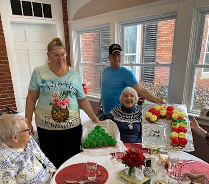 A group of people are gathered around a table for a meal.