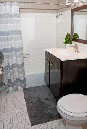 White Tile Bathroom with Large Tub and Shower at 2800 Girard Apartments in Minneapolis, MN
