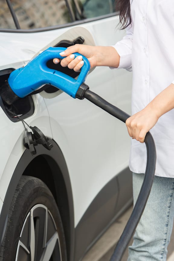an electric car is being charged at a charging station