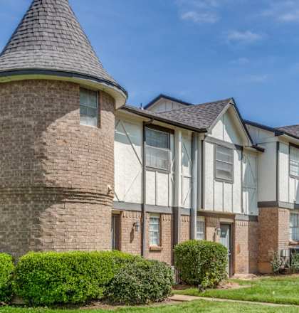 a large house with a yard in front of it