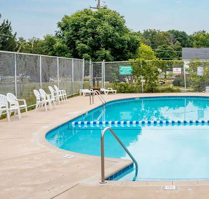 A rectangular pool with a metal ladder on each side.