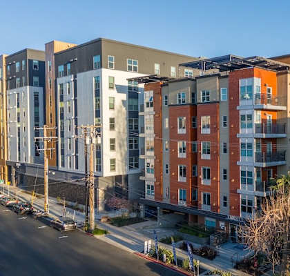 A row of modern apartment buildings are shown in the image.