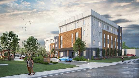 a rendering of a three story building with a person walking on the sidewalk