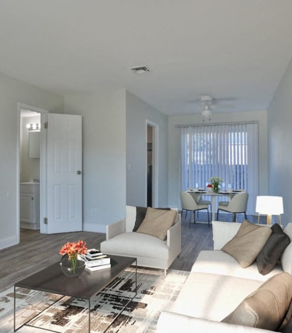 a living room with a white couch and a coffee table