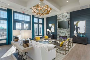 Evolv Residential at Stonehaven Apartments Community Lounge with Television and Fireplace