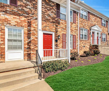 a red door on a brick building