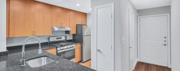 a kitchen with a granite counter top and a sink