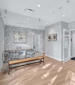 a living room with a couch and a chair