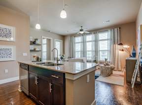 A kitchen with a sink and a counter.