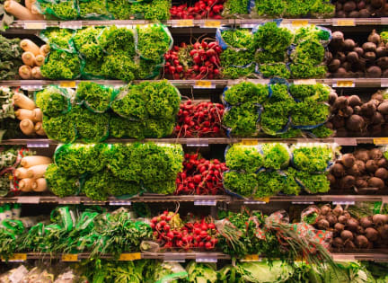 a display in a grocery store filled with lots of vegetables