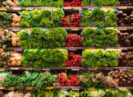 a display in a grocery store filled with lots of vegetables