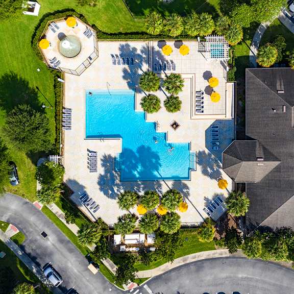 A large house with a pool in the backyard.