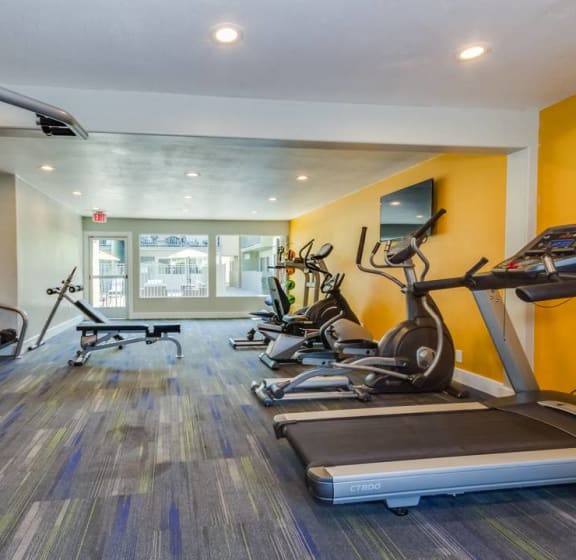 the gym in the owners home is equipped with cardio equipment and weights at Sunset Square, West Covina, 91790