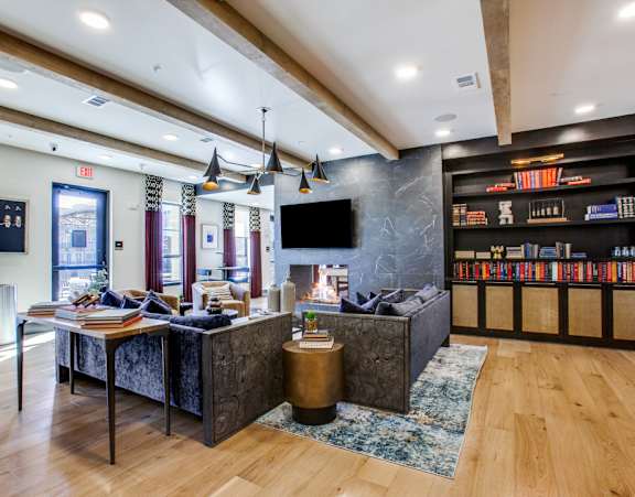 a lobby with a reception desk and a tv