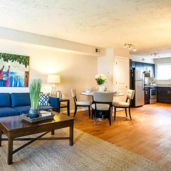 a living room with a couch and a table  at Parkside at Five Points, Raleigh