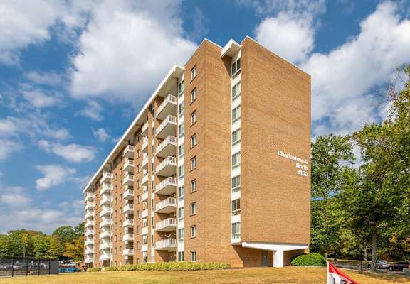 A tall brick building with the words  at Charlestowne North Apartments, Maryland
