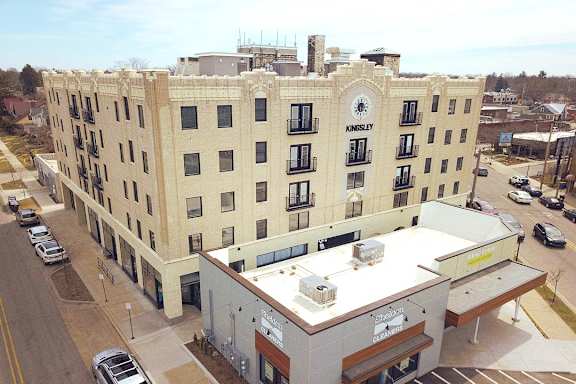 a view of a building from the roof of a parking lot