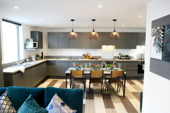 a kitchen and dining area in a 555 waverly unit