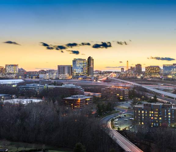an aerial view of the city at sunset