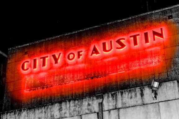 Red Sign That Says City of Austin